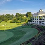 Panoramic view of a lush green golf course at Washington Golf & Country Club. Smooth