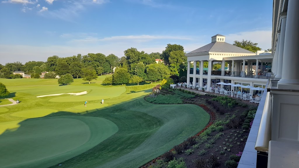 Panoramic view of a lush green golf course at Washington Golf & Country Club. Smooth