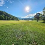Panoramic view of a lush green golf course at Wasioto Winds Golf Course. Smooth