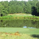 Panoramic view of a lush green golf course at Waterford Golf Club Llc. Smooth