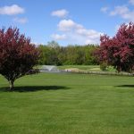 Panoramic view of a lush green golf course at Waverly Municipal Golf Course. Smooth