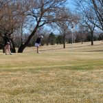 Panoramic view of a lush green golf course at Wayne Country Club. Smooth