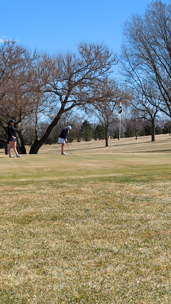 Panoramic view of a lush green golf course at Wayne Country Club. Smooth