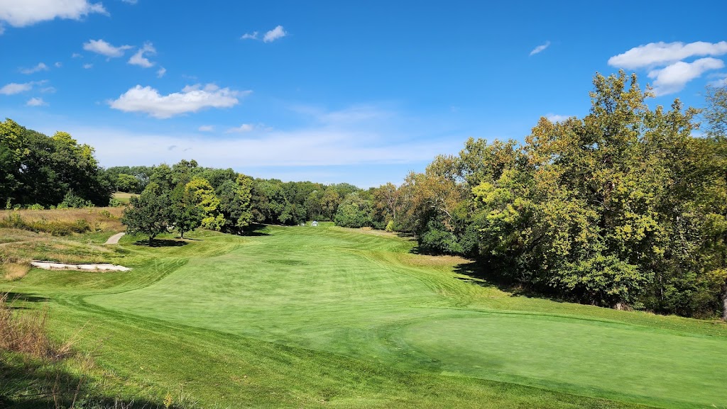 Panoramic view of a lush green golf course at WeaverRidge Golf Club. Smooth