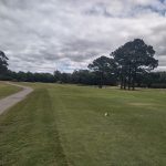 Panoramic view of a lush green golf course at Wedgewood Golf Course. Smooth