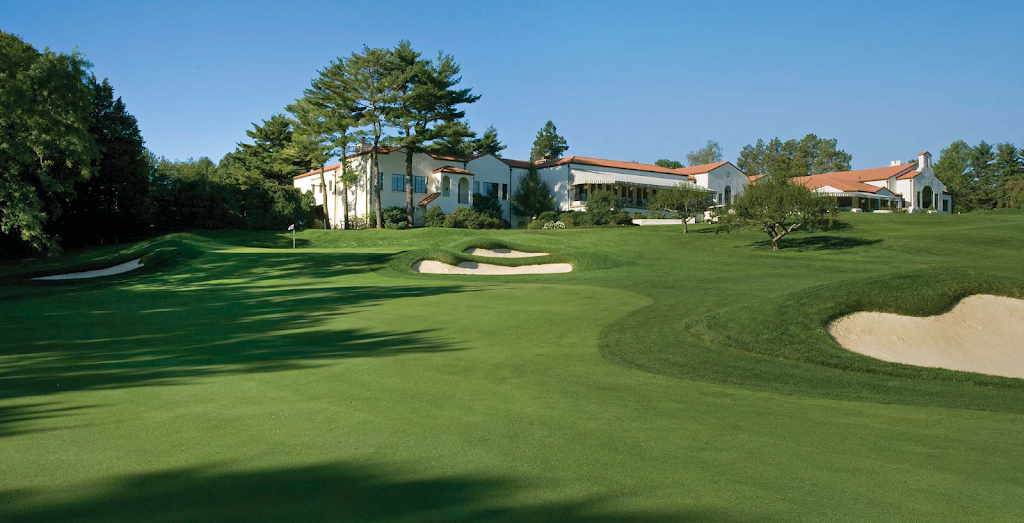 Panoramic view of a lush green golf course at Wee Burn Country Club. Smooth