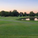 Panoramic view of a lush green golf course at Weibring Golf Club. Smooth