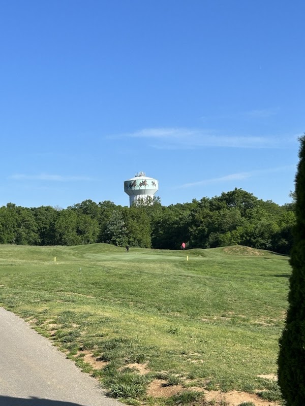 Panoramic view of a lush green golf course at Weissinger Hills Golf Course. Smooth