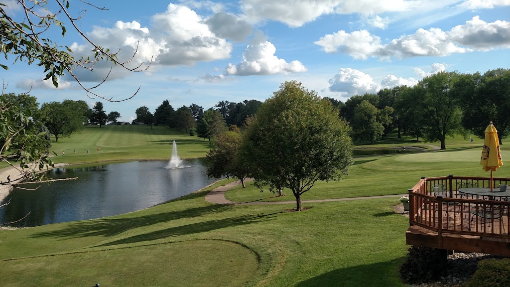 Panoramic view of a lush green golf course at West Liberty Country Club. Smooth