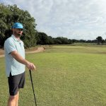 green grass with the flag in the hole.