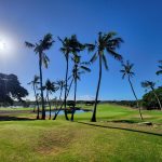 Panoramic view of a lush green golf course at West Loch Golf Course. Smooth
