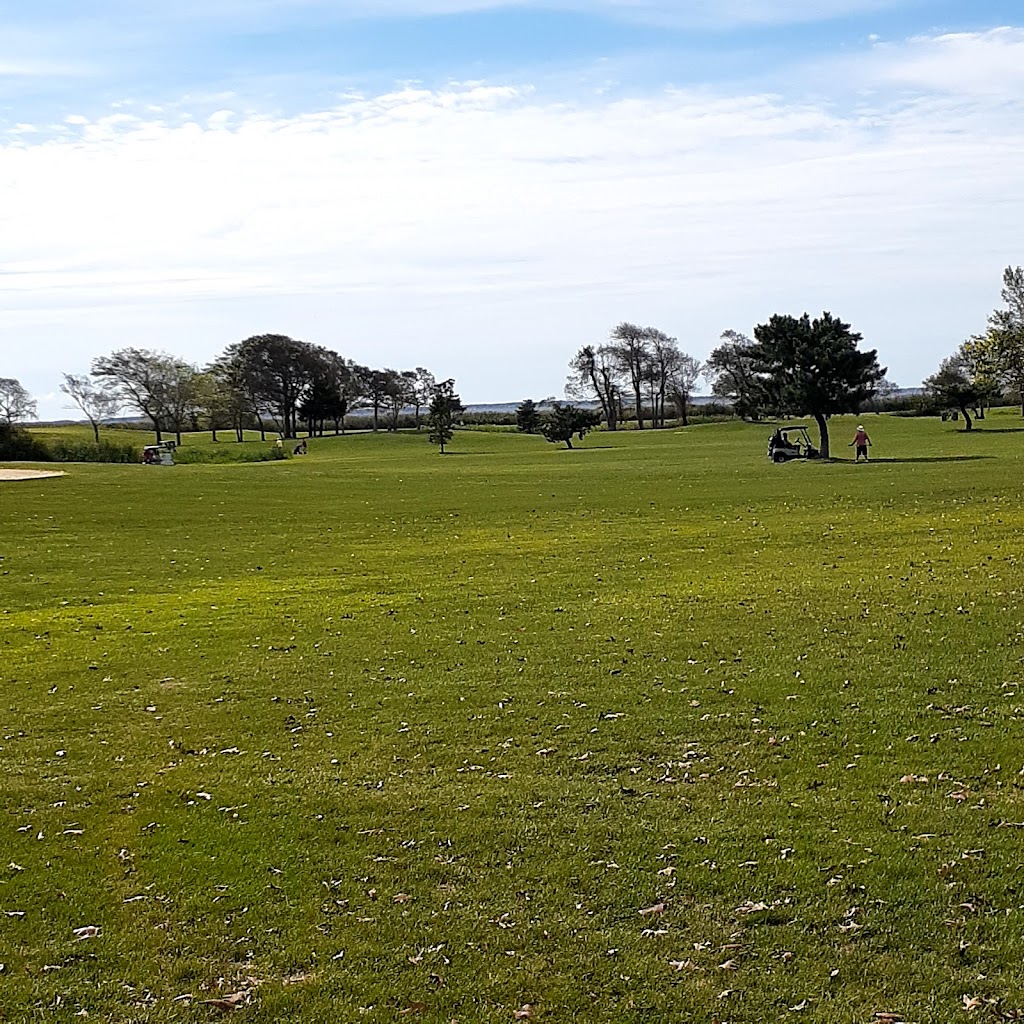 Panoramic view of a lush green golf course at West Sayville Golf Course. Smooth