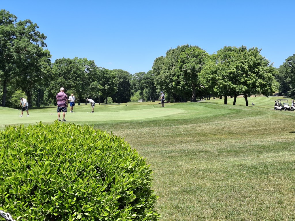 Panoramic view of a lush green golf course at Western Hills Golf Course. Smooth