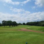 Panoramic view of a lush green golf course at Western Lakes Golf Club & Event Venue. Smooth