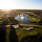 Panoramic view of a lush green golf course at Western Skies Golf Club. Smooth