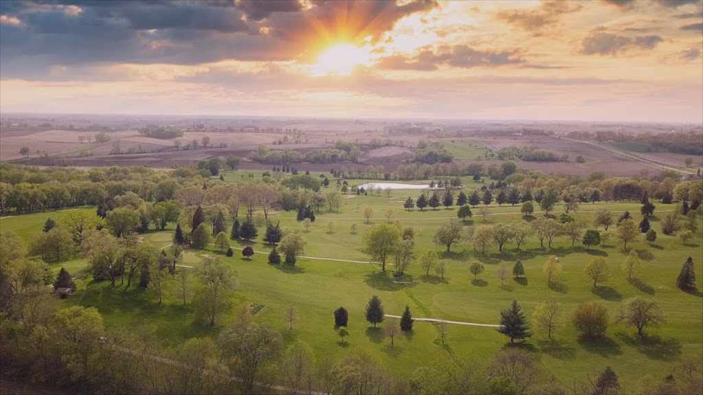 Panoramic view of a lush green golf course at Westwood Golf Course. Smooth