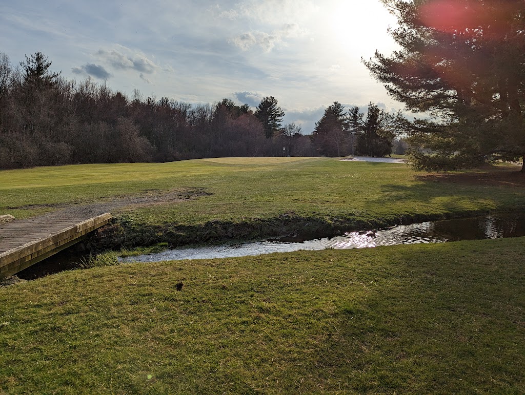 Panoramic view of a lush green golf course at Westwoods Golf Course. Smooth