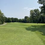 Panoramic view of a lush green golf course at Westwynd Golf Course. Smooth