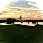 Panoramic view of a lush green golf course at Wetlands Golf Course. Smooth