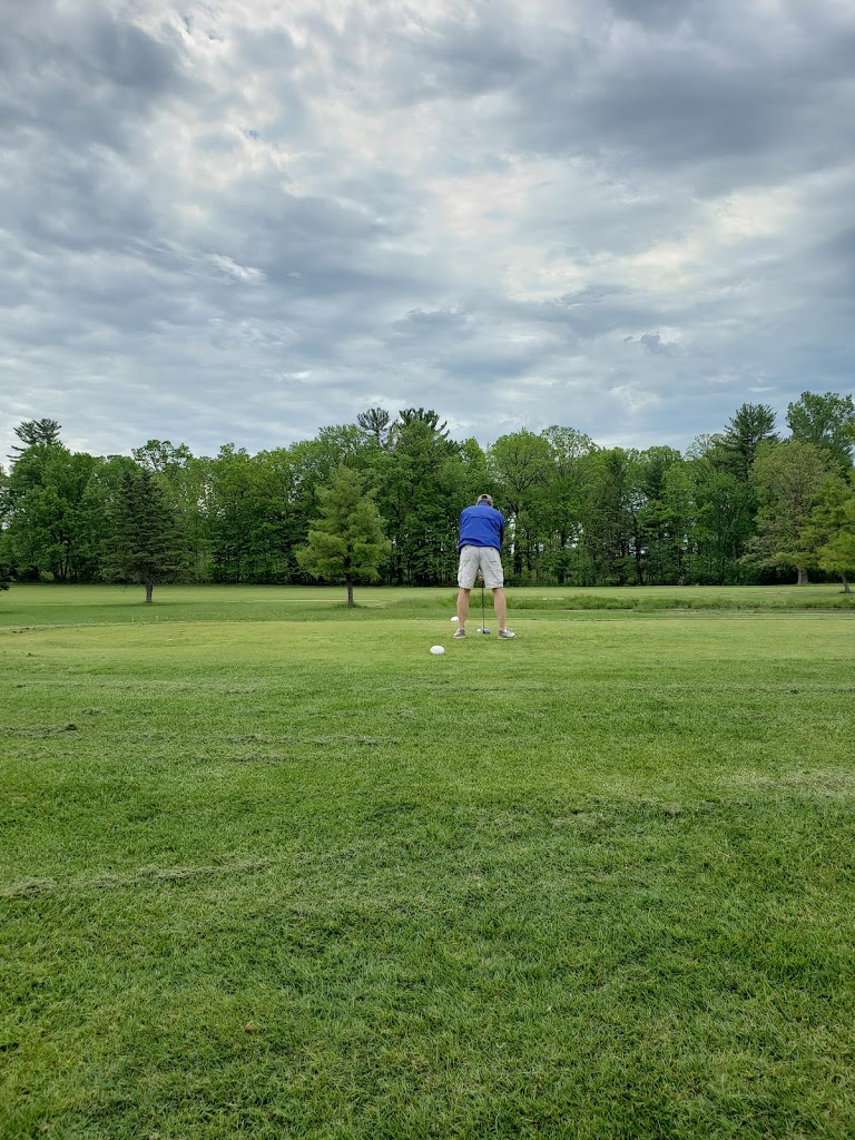 Panoramic view of a lush green golf course at Weymont Run Country Club. Smooth