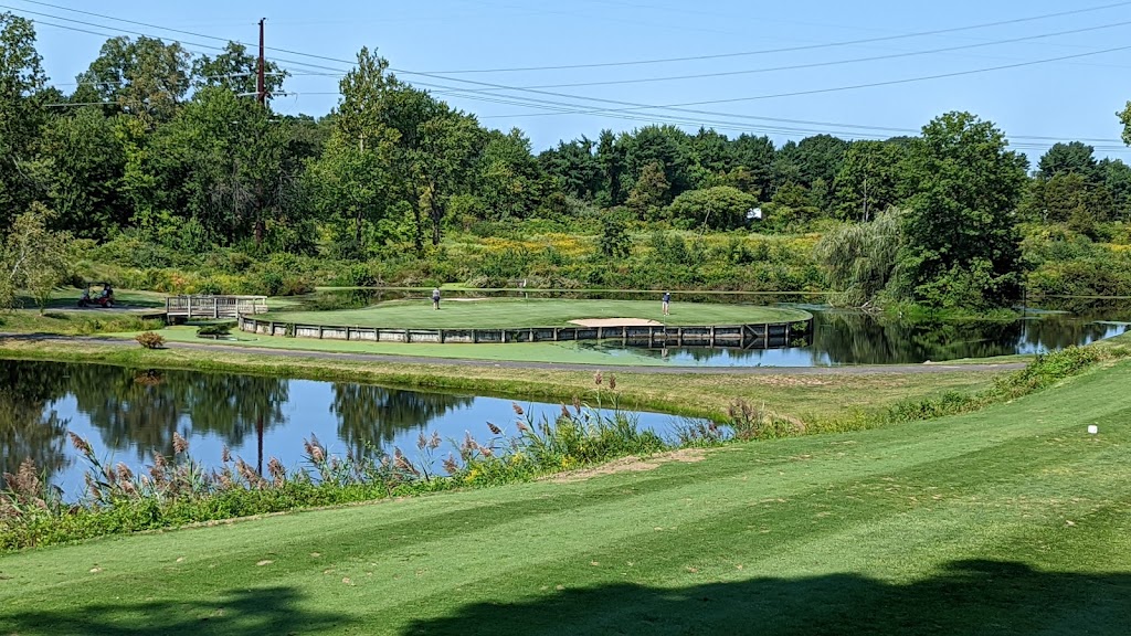 Panoramic view of a lush green golf course at Wheeler Family Traditions Golf Club. Smooth