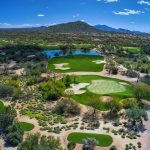 Panoramic view of a lush green golf course at Whisper Rock Golf Club. Smooth