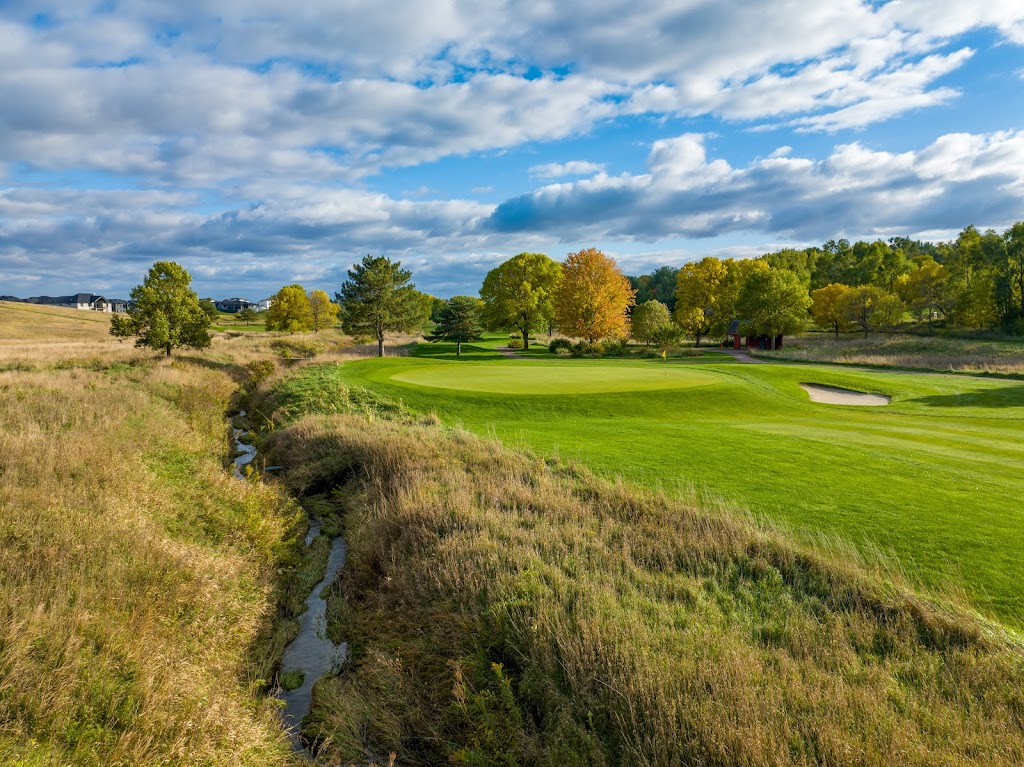 Panoramic view of a lush green golf course at Whispering Creek Golf Club. Smooth