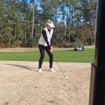 green grass with the flag in the hole.