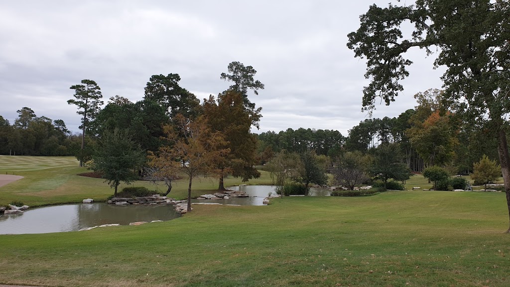 Panoramic view of a lush green golf course at Whispering Pines Golf Club. Smooth