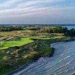 Panoramic view of a lush green golf course at Whistling Straits Golf Course. Smooth