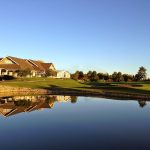 Panoramic view of a lush green golf course at White Deer Run Golf Course. Smooth