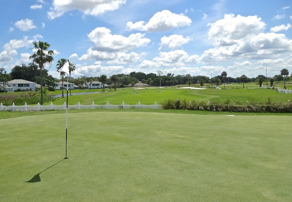 Panoramic view of a lush green golf course at White Heron Golf Club. Smooth