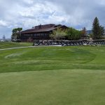 Panoramic view of a lush green golf course at White Mountain Golf Course. Smooth