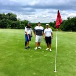 green grass with the flag in the hole.