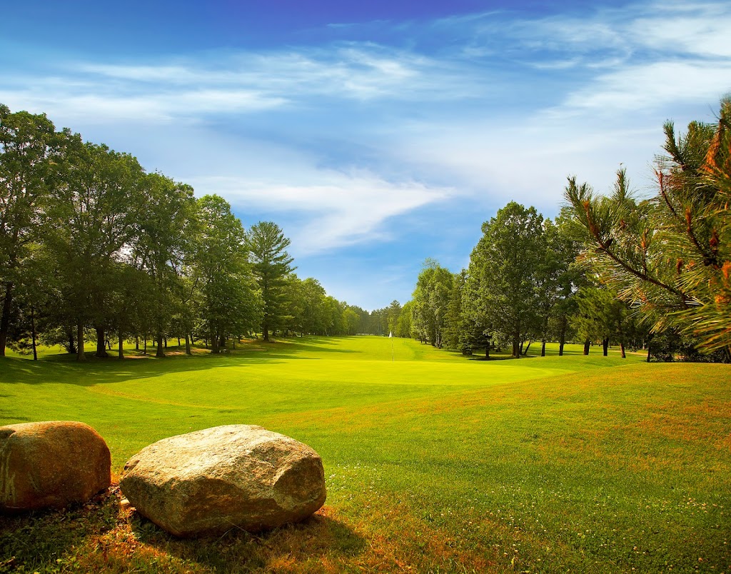 Panoramic view of a lush green golf course at Whitefish Golf Club. Smooth