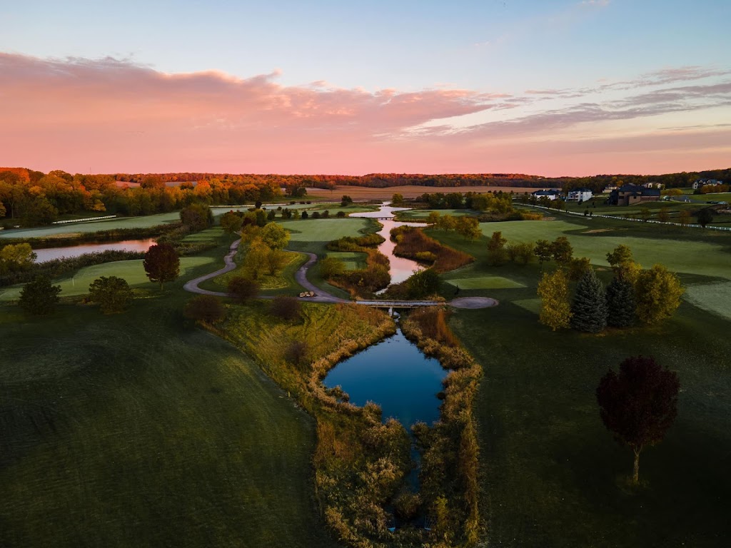 Panoramic view of a lush green golf course at Whitetail Ridge Golf Club. Smooth