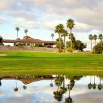 Panoramic view of a lush green golf course at Wickenburg Golf Club. Smooth