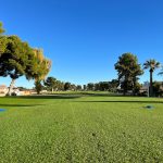 Panoramic view of a lush green golf course at Wigwam Golf Club. Smooth