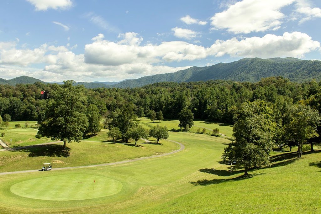 Panoramic view of a lush green golf course at Wild Laurel Golf Course. Smooth