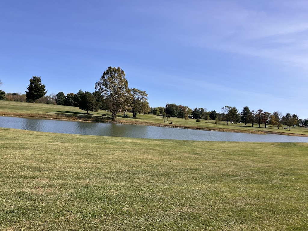 Panoramic view of a lush green golf course at Wild Turkey Trace. Smooth