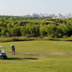 Panoramic view of a lush green golf course at Wildcat Golf Club. Smooth