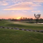 Panoramic view of a lush green golf course at Wildcat Golf Course. Smooth