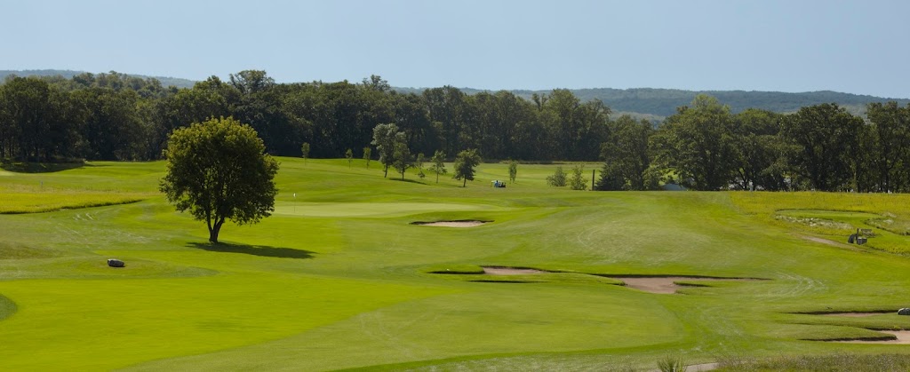 Panoramic view of a lush green golf course at Wildflower Golf Course. Smooth