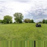 green grass with the flag in the hole.