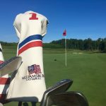 green grass with the flag in the hole.