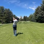 green grass with the flag in the hole.