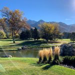 Panoramic view of a lush green golf course at Willow Creek Country Club. Smooth