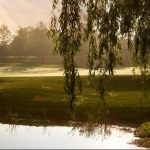 Panoramic view of a lush green golf course at Willow Creek Golf & Country Club - NY. Smooth