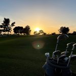 green grass with the flag in the hole.