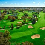 Panoramic view of a lush green golf course at Willow Crest Golf Club. Smooth